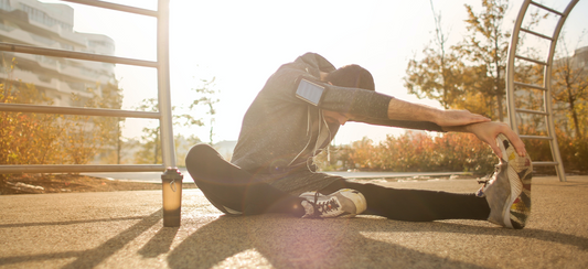 runner doing post-run stretches for recovery