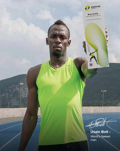 Usain Bolt holding Enertor Walking Insoles